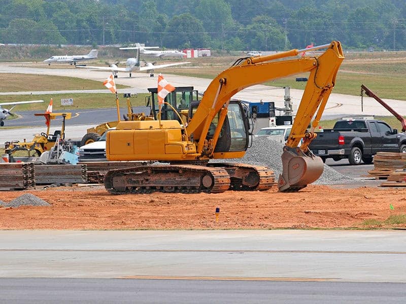 Runway Construction Heavy construction equipment working on an airport runway