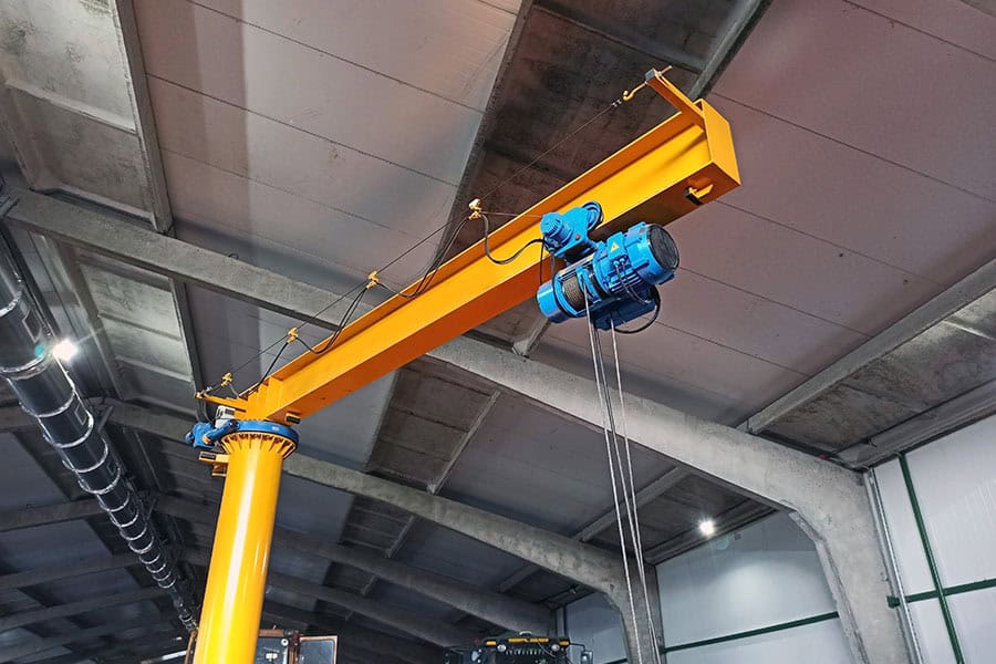 Indoor jib crane for repairing agricultural machinery. Indoor jib crane for repairing agricultural machinery. Industrial equipment.